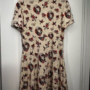 This beautiful WOMENS brand new 2xl Sourpuss dress. It's soft stretchy material.
